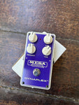 Purple Mesa Boogie Dyaplex effects pedcal, four white control knobs, single button switch