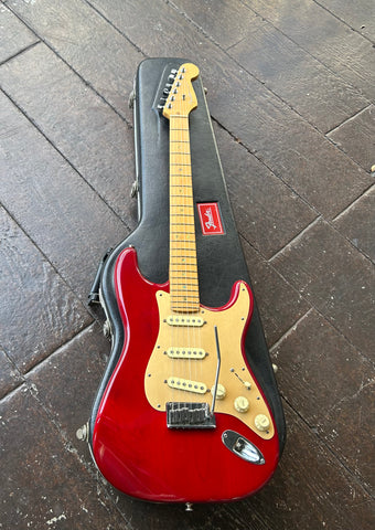 1999 Fender Deluxe Stratocaster Crimson Transparent finish, gold anodized pick-guard maple neck and maple headstock