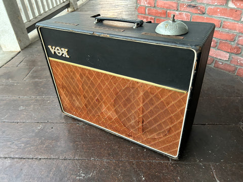 1963 Vox AC-10 JMI tube amplifier black front with red grill cloth