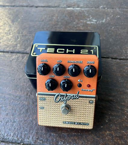 Tech 21 NYC Oxford, orange and tan pedal, with six black knob control, single button control button
