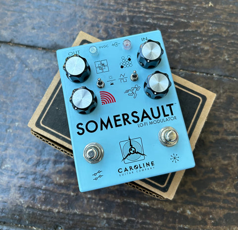 Light blue Caroline Guitar Company Somersault Lo-Fi Modulator, four knob controls, two button foot switch