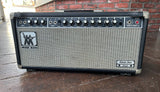 Black tolex Music Man guitar amplifier head, with black control panel, ten knob control, grey grill cloth