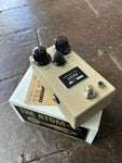 Tan effect pedal Atom, with three control knobs, one button switch