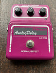 Maxon Analog Delay AD-900 purple pedal with three control knobs and single button footswitch