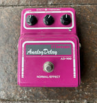 Maxon Analog Delay AD-900 purple pedal with three control knobs and single button footswitch