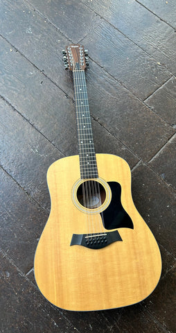 2014 Taylor 150e Twelve String acoustic guitar, spruce top with rosewood fretboard and rosewood headstock