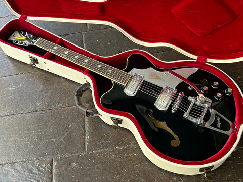 Black Kay archtop, chrome hardware with rosewood inlay and black headstock