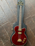 Full shot of Epiphone Allen Woody Rumblekat Bass atop hardshell case