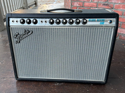 Fender Deluxe Reverb-Amp, black tolex, grey grill cloth and metal control panel, eight control knobs