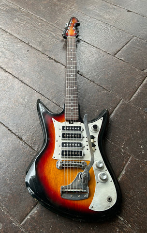 Sunburst Teisco electric guitar with four pick-ups, tremolo , rosewood neck , sunburst headstock