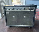 Roland Jazz Chorus 120 amplifier, black toley. grey front panel with twelve knob controls and greay and tan grill cloth