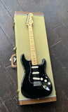 Black 2011 Fender Stratocaster , with maple fretboard and maple headstock
