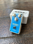 Light blue pedal, three white button controls, single button switch