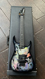 Badlands Guitar Co. GX1 Holoflash, muticolor finish top, with black hardware and pick-ups and ebony neck with black headstock
