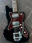 Close up Black silvertone body, tortoise pick guard. metal bigsby with four knobs, two metal pick ups