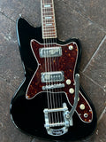 Close up Black silvertone body, tortoise pick guard. metal bigsby with four knobs, two metal pick ups