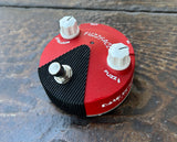 Red mini Dunlop Guitar fuzzface pedal, with two white control knobs, single button metal foot switch