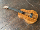 Top view Koa ukulele with ebony bridge, ebony fret board with pearl fret markers, koa headstock