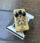 Gold Keeley El Rey Dorado pedal, with three black knob controls, single button foot-switch