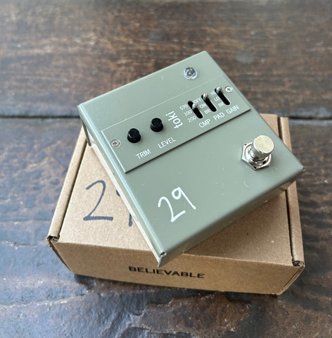 29 Pedals TOKI Fuzzy Driver grey pedal with two button push controls and three switches, with single button metal foot switch 