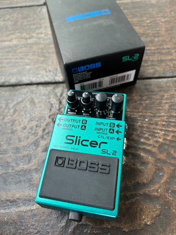 Teal Boss Slicer SL-2 effects pedal with four control knobs